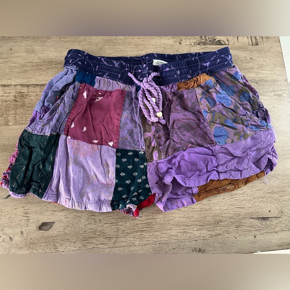 Advance Apparels women’s purple patchwork shorts with pockets, size S/M